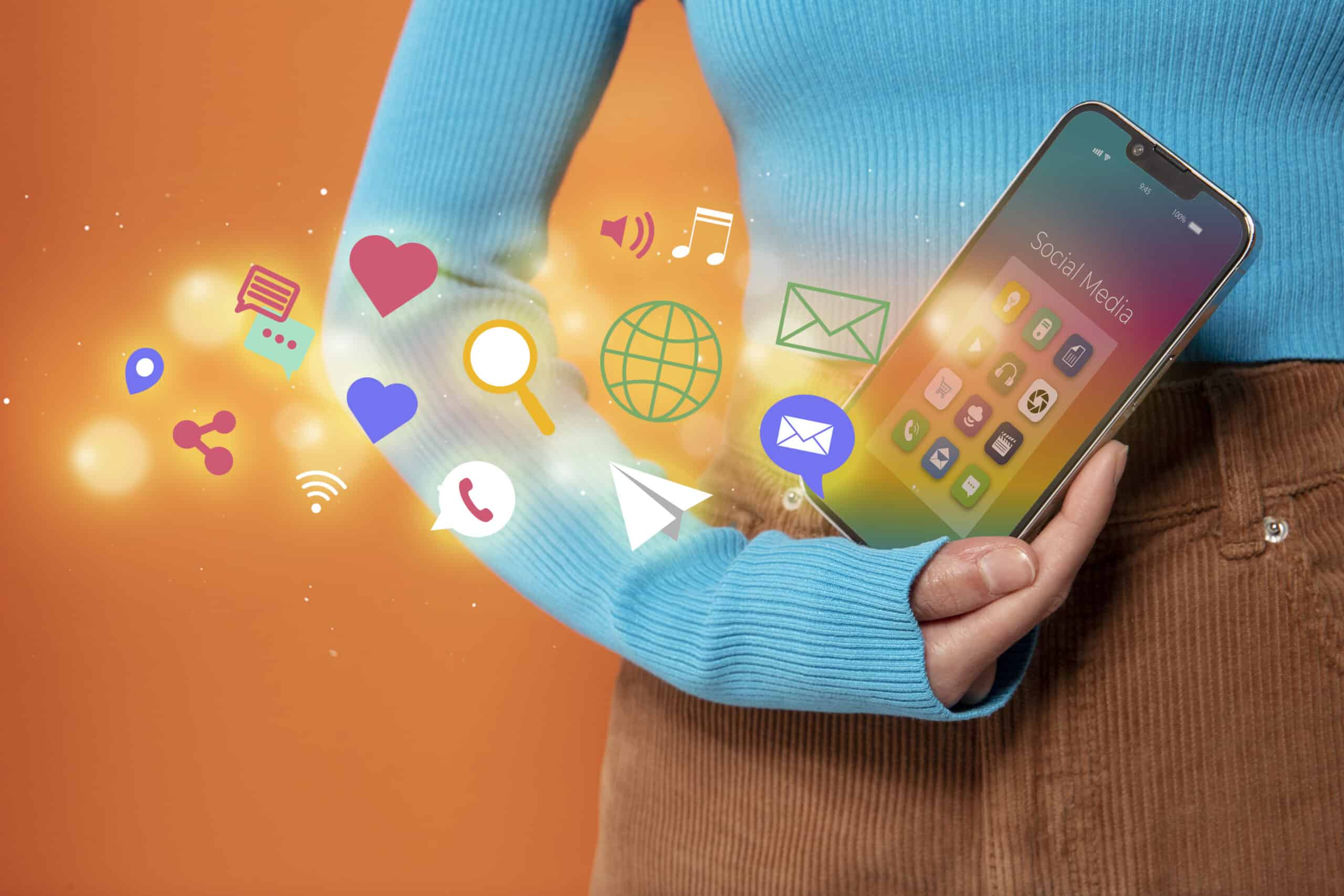 Mobile Marketing Strategies Every Marketer Should Know - Image of a person holding a smartphone with marketing icons and strategies displayed on the screen.